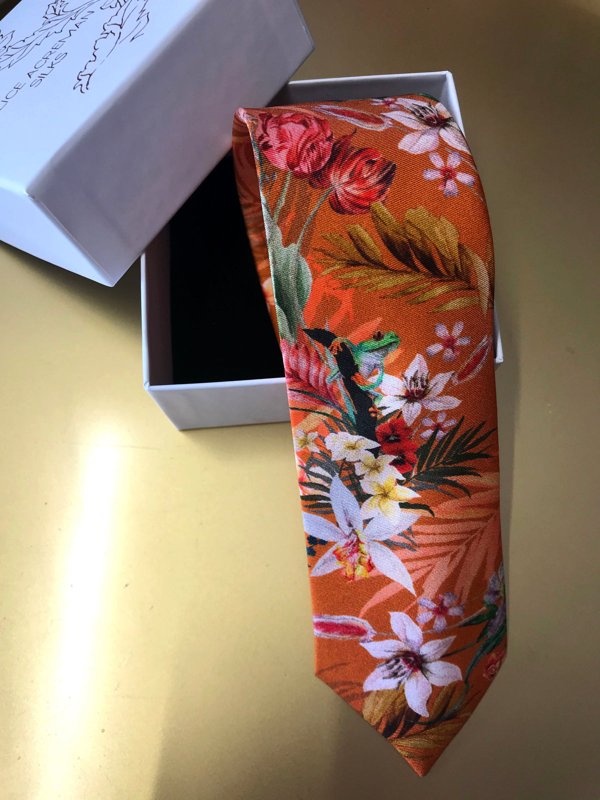 Rust orange coloured Silk Tie, 'Eden' tropical meadow print
