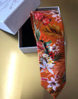 Rust orange coloured Silk Tie, 'Eden' tropical meadow print
