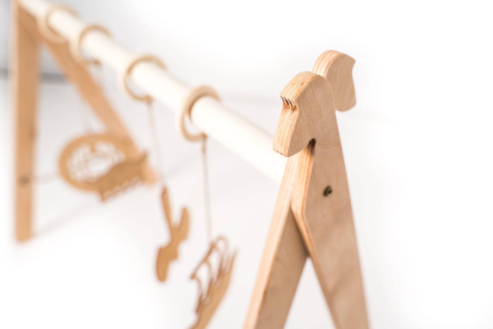 Viking-Themed Wooden Baby Gym – Safe &amp; Fun Development Toy by Ewart Woods at www.brixbailey.com
