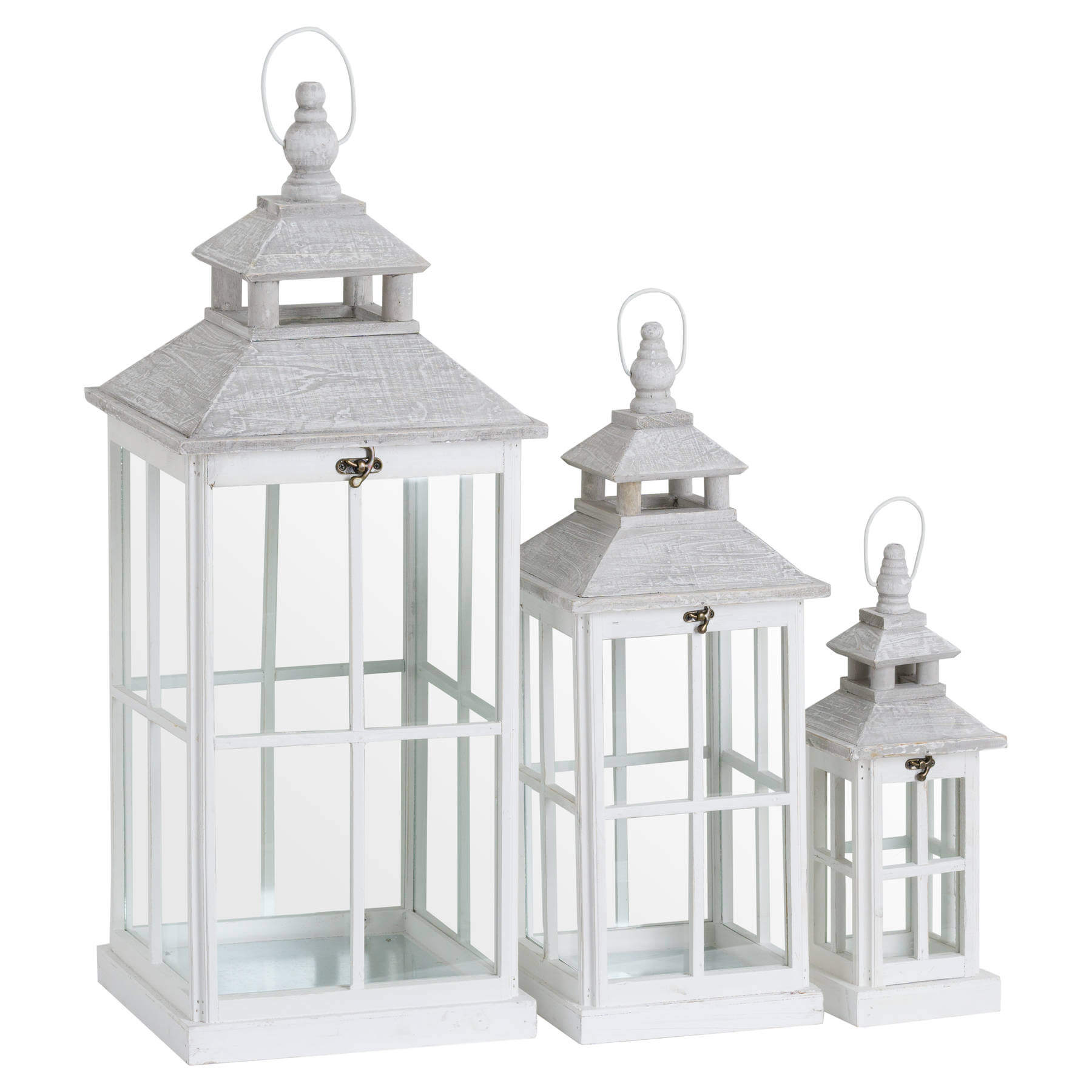 White wooden lantern with intricate window detailing, casting light patterns for coastal or Scandinavian decor. by RoomLondon at brixbailey.com