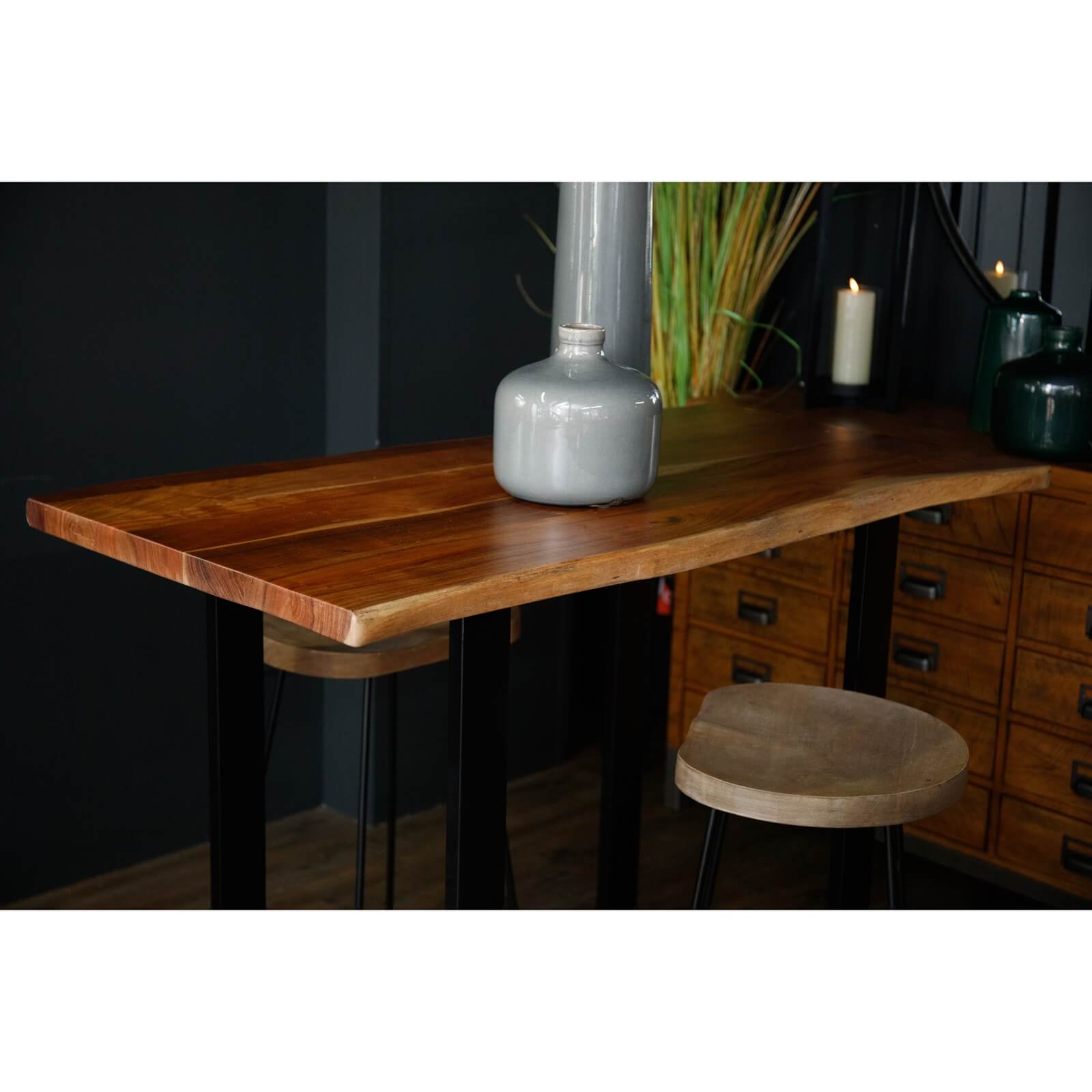 Live edge acacia wood bar table with black metal base, showcasing natural grain and rustic-industrial style. by RoomLondon at brixbailey.com