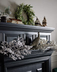 Snow-dusted winter branch decor, 43-inch lifelike plastic foliage for festive mantel or centerpiece displays  by sostter at brixbailey.com