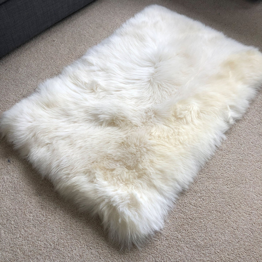 Premium British sheepskin rug, luxury ivory white fur throw, soft plush rectangular 55cm x 85cm, handcrafted sustainable free-range wool by Wildash London at brixbailey.com