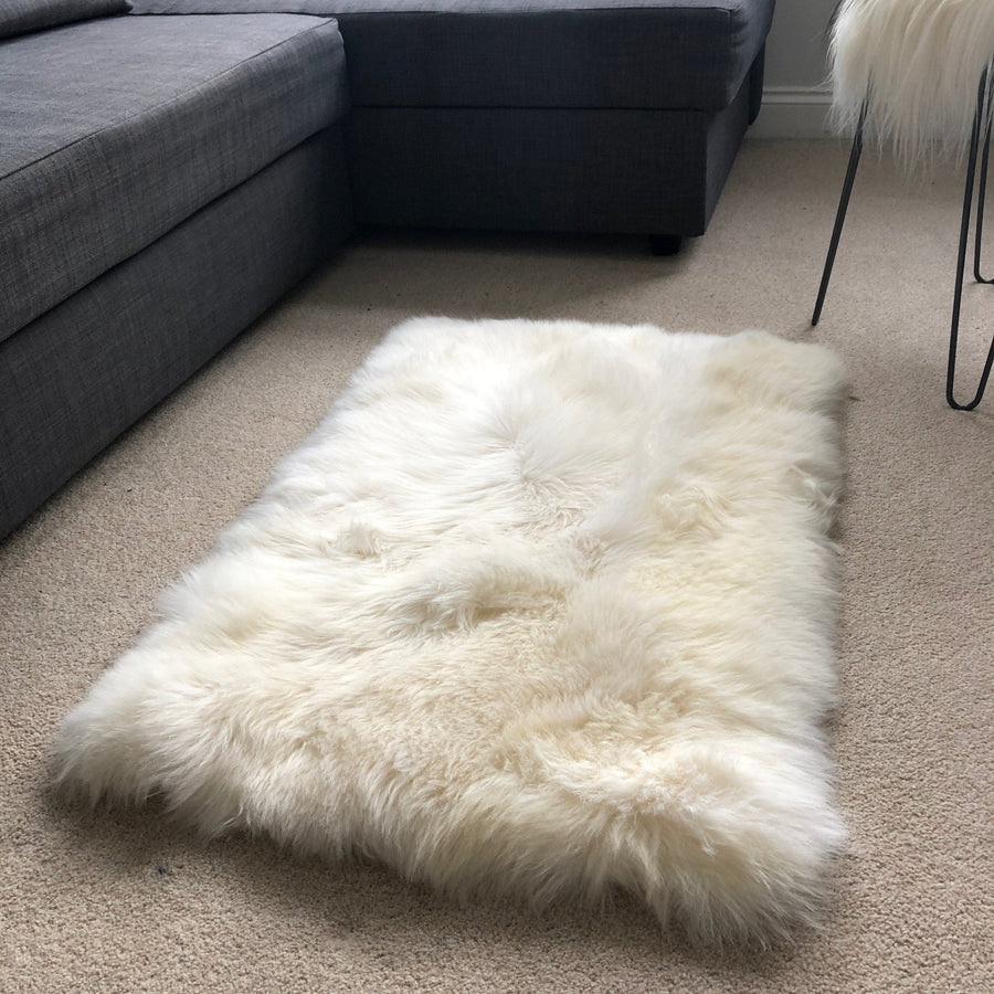 Premium British sheepskin rug, luxury ivory white fur throw, soft plush blanket, 55cm x 85cm, handcrafted sustainable sheepskin by Wildash London at brixbailey.com