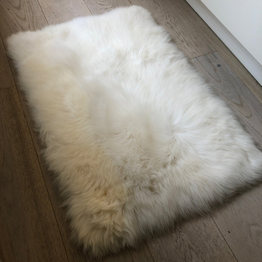 Premium British Sheepskin Rug, Luxurious Soft White Fur Throw, Handcrafted Ivory Cream Rectangular 55cm x 85cm by Wildash London at brixbailey.com