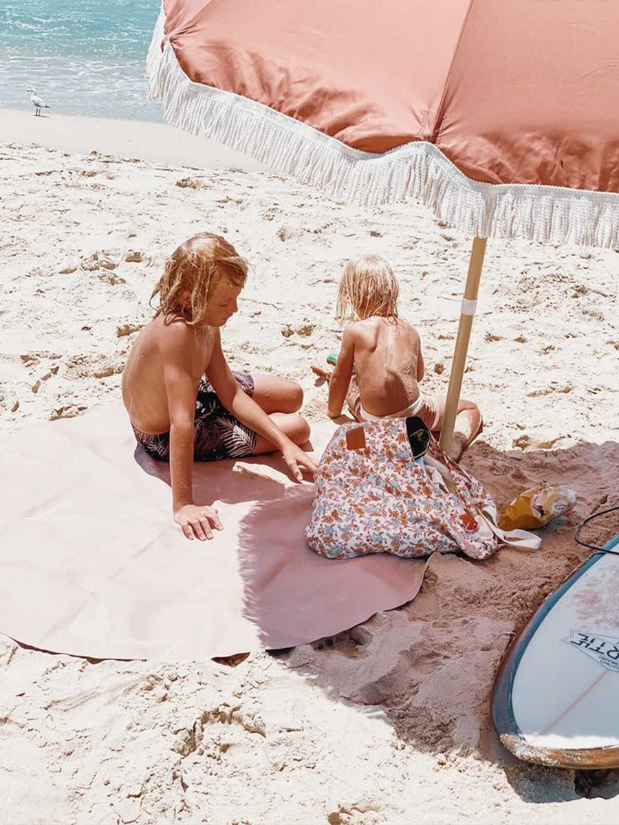 Luxury vegan leather maxi circle mat, portable travel mat for beach, park, or home, water-resistant with suede bottom and hanging strap by Faemli at brixbailey.com