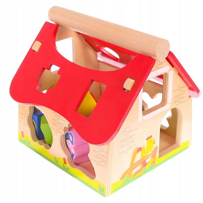 softly lit wooden farmhouse shape sorter with friendly animal figures on a cozy nursery rug
