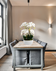 Faux orchid centerpiece in white vase