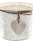 Mercury glass heart candle holder with hammered dots and twine bow, vintage rustic decor for mantels or tables   

- **Keywords included:** mercury glass, heart candle holder, hammered dots, twine bow, vintage rustic decor, mantels, tables  
- **Clear description:** Visually conveys the product's material, design, and decorative use  
- **SEO & accessibility optimized:** Prioritizes key product features while remaining natural for screen readers by RoomLondon at brixbailey.com