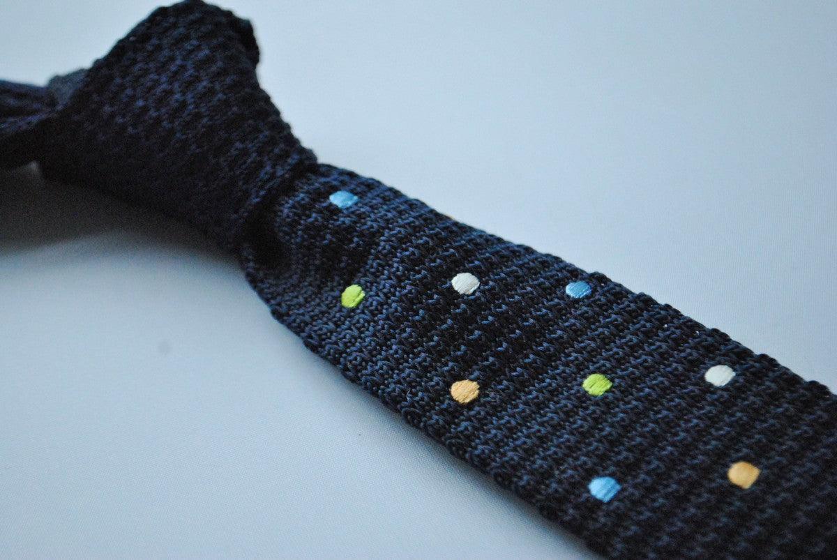 navy blue skinny knitted tie with multicoloured polka dots