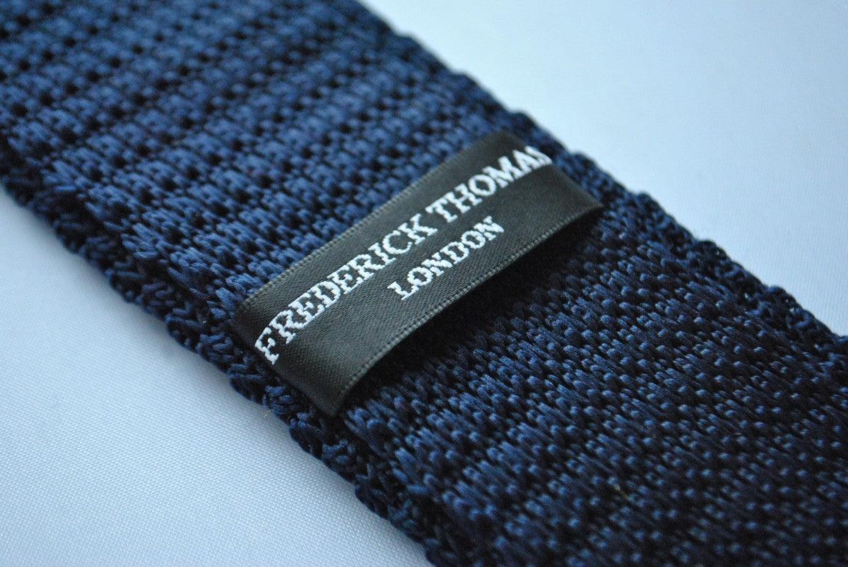 navy blue skinny knitted tie with multicoloured polka dots