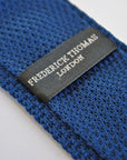navy blue skinny knitted tie with brown polka dots