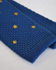 navy blue skinny knitted tie with brown polka dots