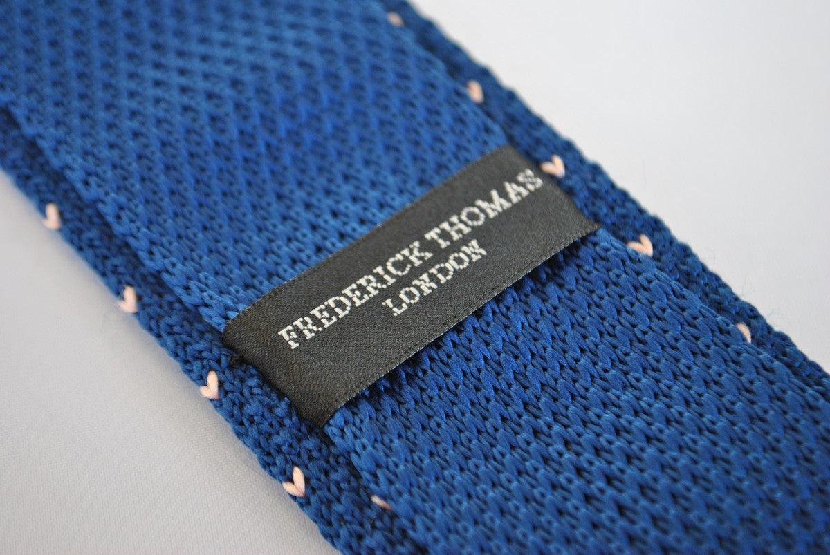 navy blue skinny knitted tie with pink polka dots