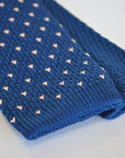 navy blue skinny knitted tie with pink polka dots