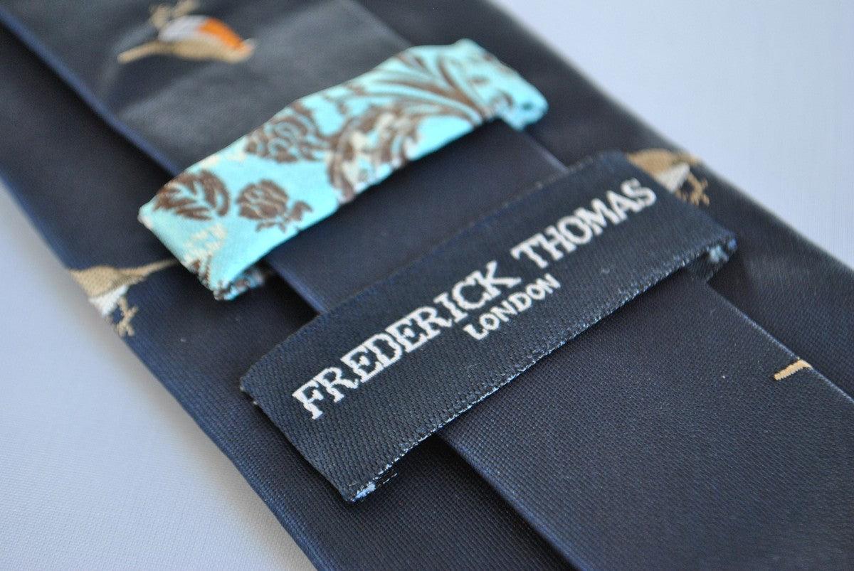 navy  tie with embroidered robin design