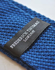 navy blue skinny knitted tie with powder pink polka dots