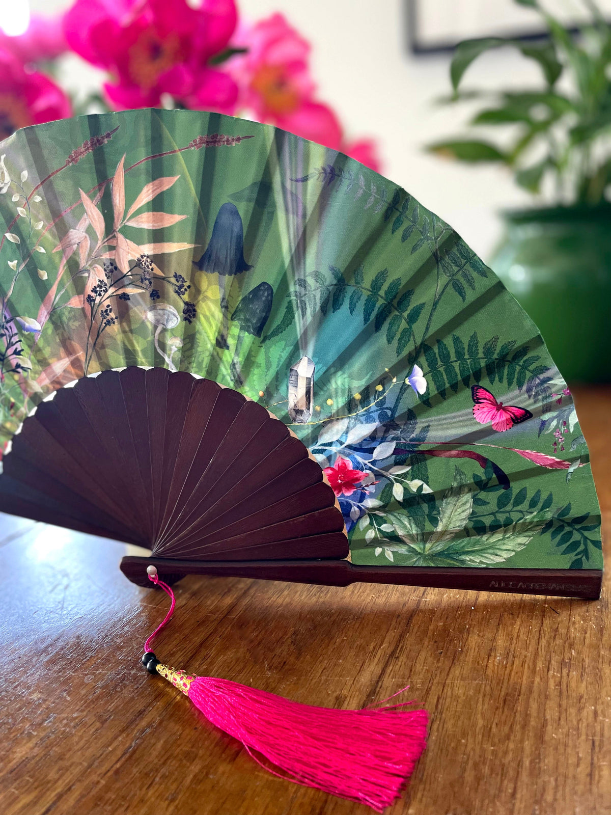 Green hand-held silk fan with 'Greenery' mushroom and crystal botanical artwork