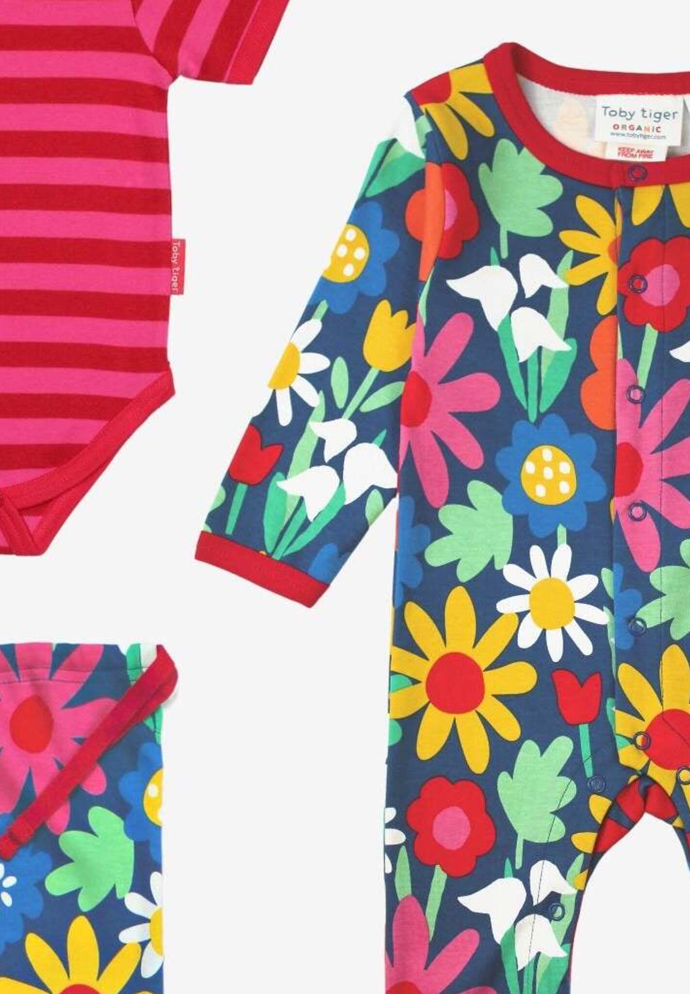 Luxury Organic Baby Gift Set with Floral Print, Hat, Bodysuit, and Tote Bag in Dark Blue by Toby Tiger at brixbailey.com