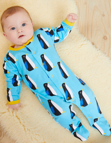 Premium Organic Baby Gift Set with Penguin Print Onesie, Hat, and Bag in Soft Blue and Yellow by Toby Tiger at brixbailey.com