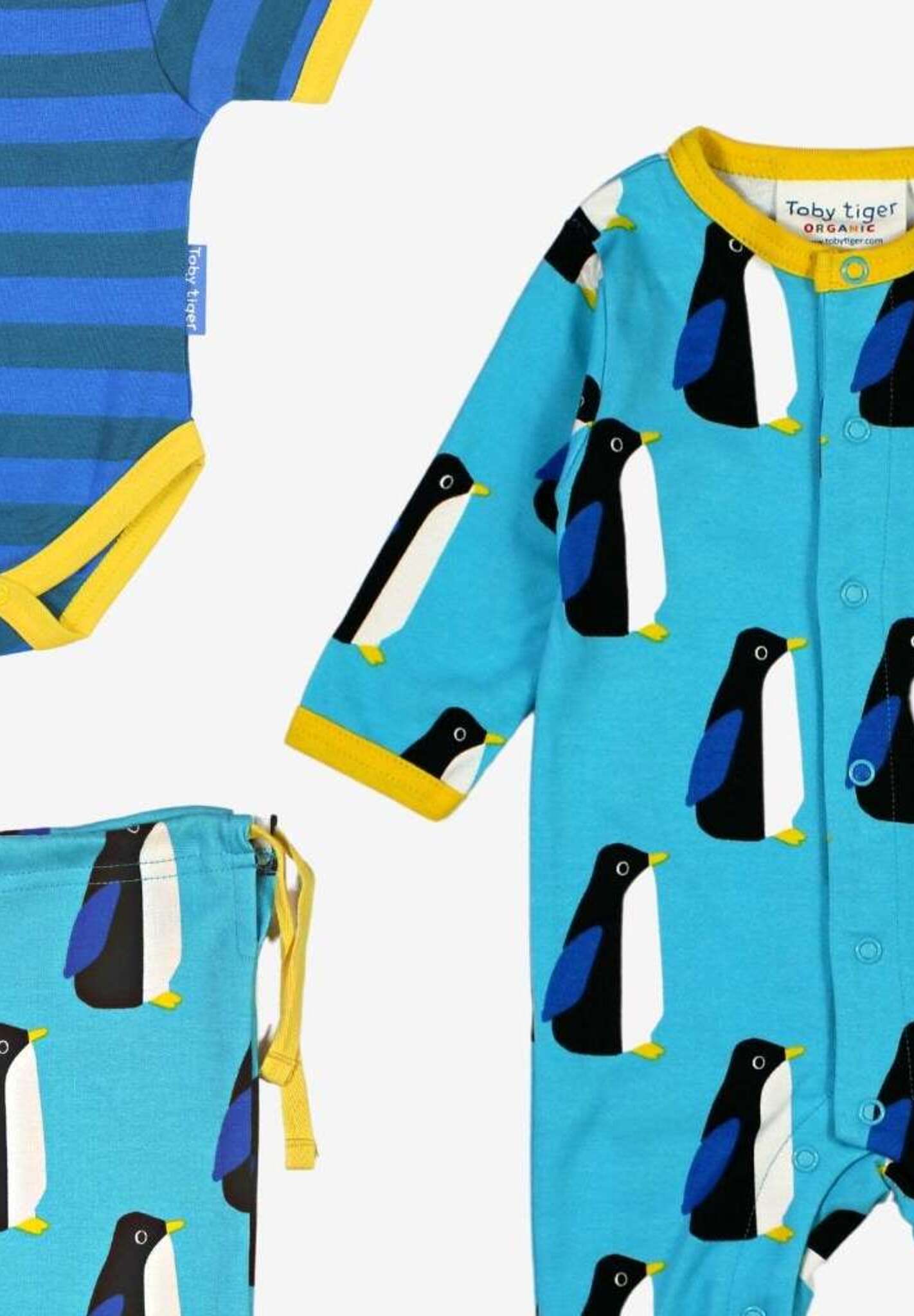 Premium Organic Baby Gift Set with Penguin Print Romper, Hat, and Bag in Soft Blue and Yellow - GOTS Certified Cotton by Toby Tiger at brixbailey.com