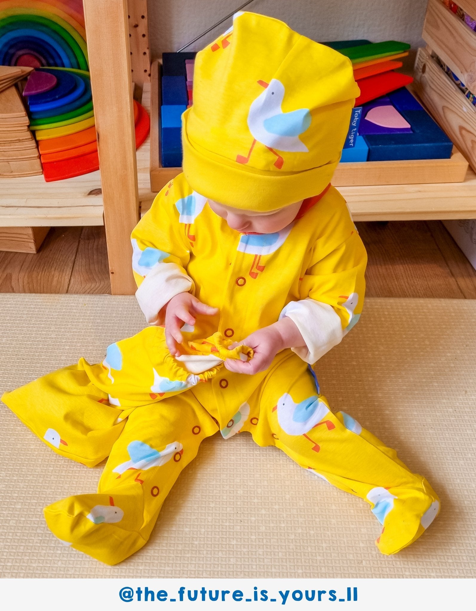 Premium organic cotton baby gift set with yellow seagull print, cozy pajamas, hat, onesie, drawstring bag by Toby Tiger at brixbailey.com