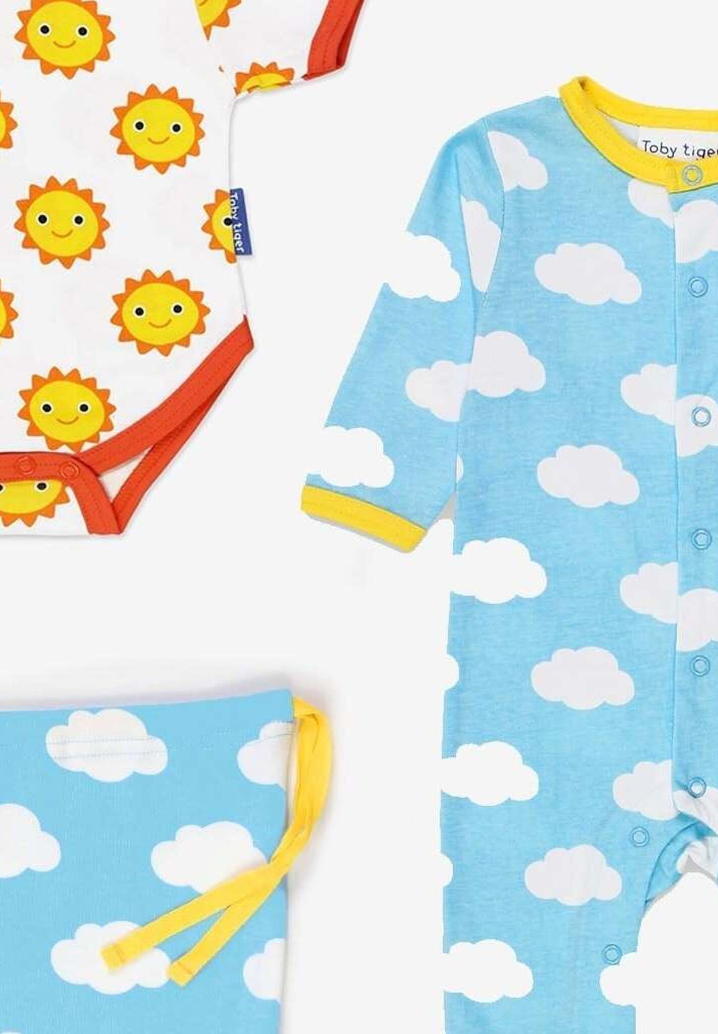 Premium Organic Cotton Baby Gift Set with Hat, Onesie and Romper in Cute Sun and Clouds Print by Toby Tiger at brixbailey.com