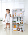 bold front view of the wooden dollhouse luna with glowing led lights illuminating its four vibrant rooms