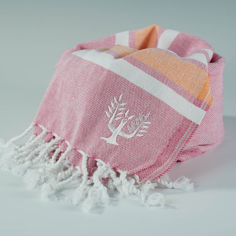 Luxury Hampton Hammam Towel, premium soft cotton, pink and orange stripe, quick-drying, handloomed in Turkey, stylish yacht and beach accessory by Wildash London at brixbailey.com