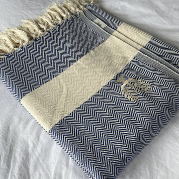 Luxury Harrington Bed Throw XL, premium oversized organic cotton blanket, navy blue herringbone design, handloomed, best-selling king size throw by Wildash London at brixbailey.com