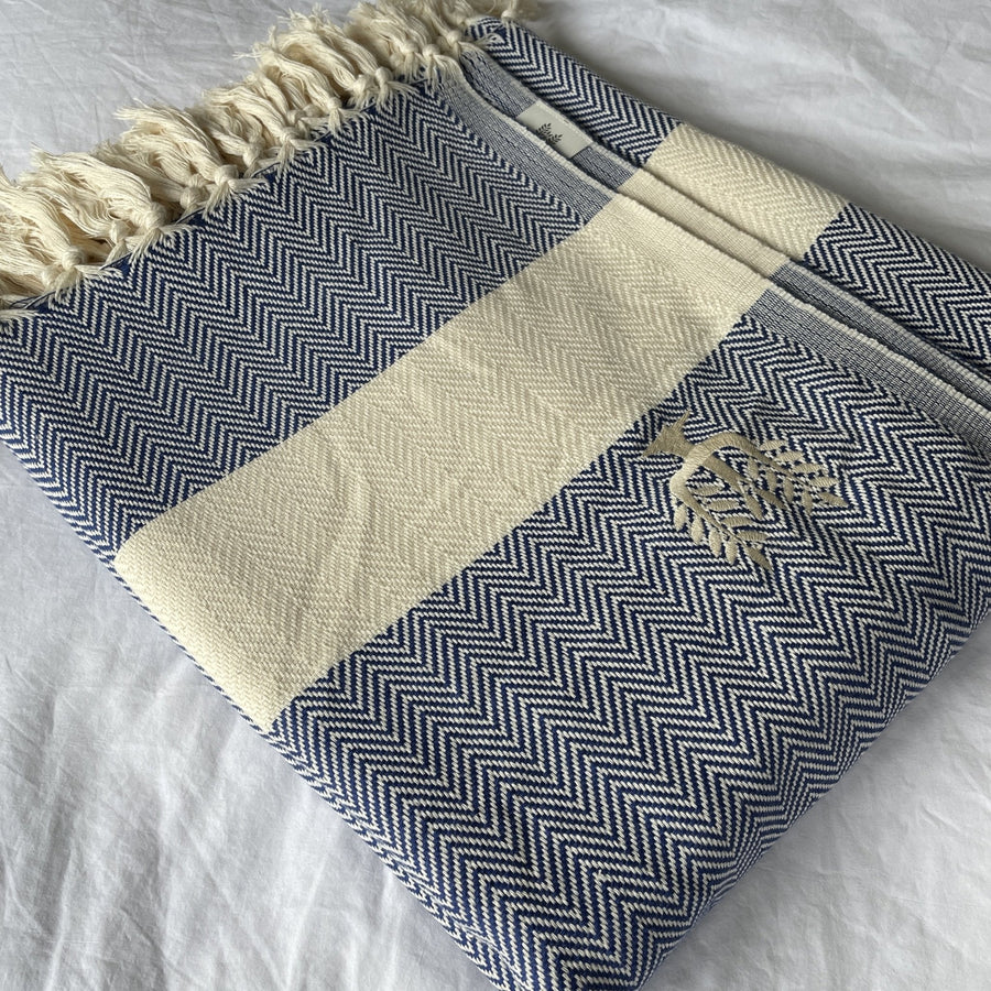 Luxury Harrington Bed Throw XL, premium oversized organic cotton blanket, navy blue herringbone design, handloomed, best-selling king size throw by Wildash London at brixbailey.com