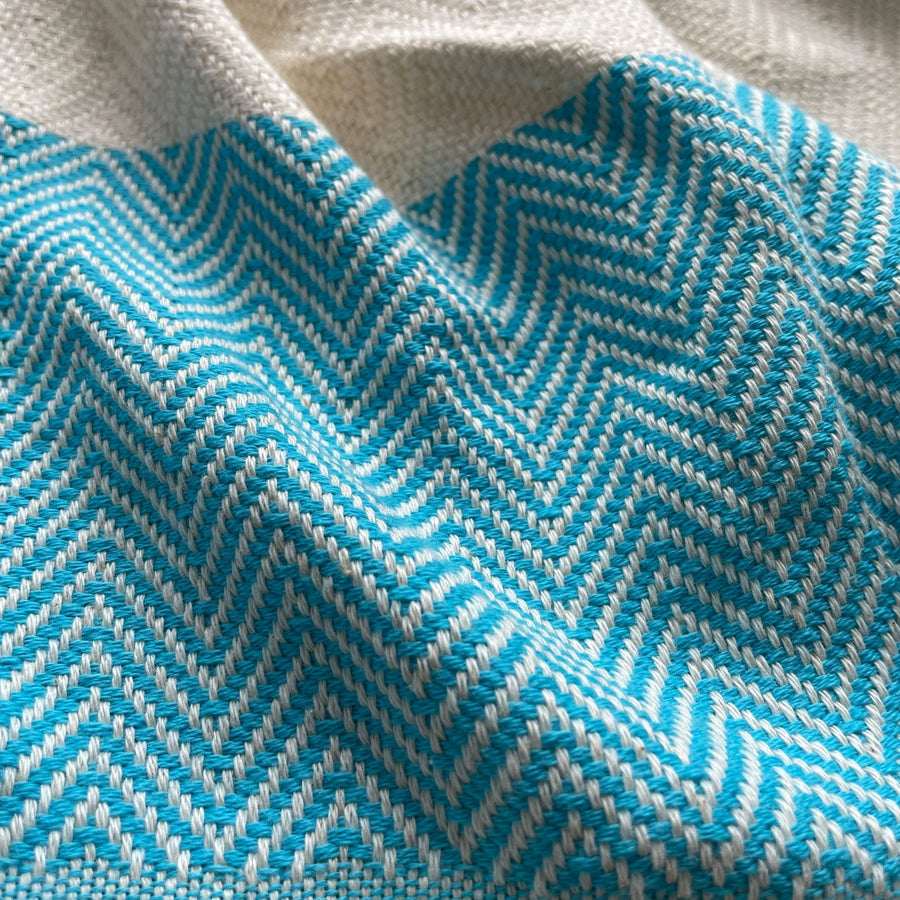 Luxury Harrington Bed Throw XL, premium oversized handloomed organic cotton blanket, teal and natural herringbone design, best-selling king size by Wildash London at brixbailey.com