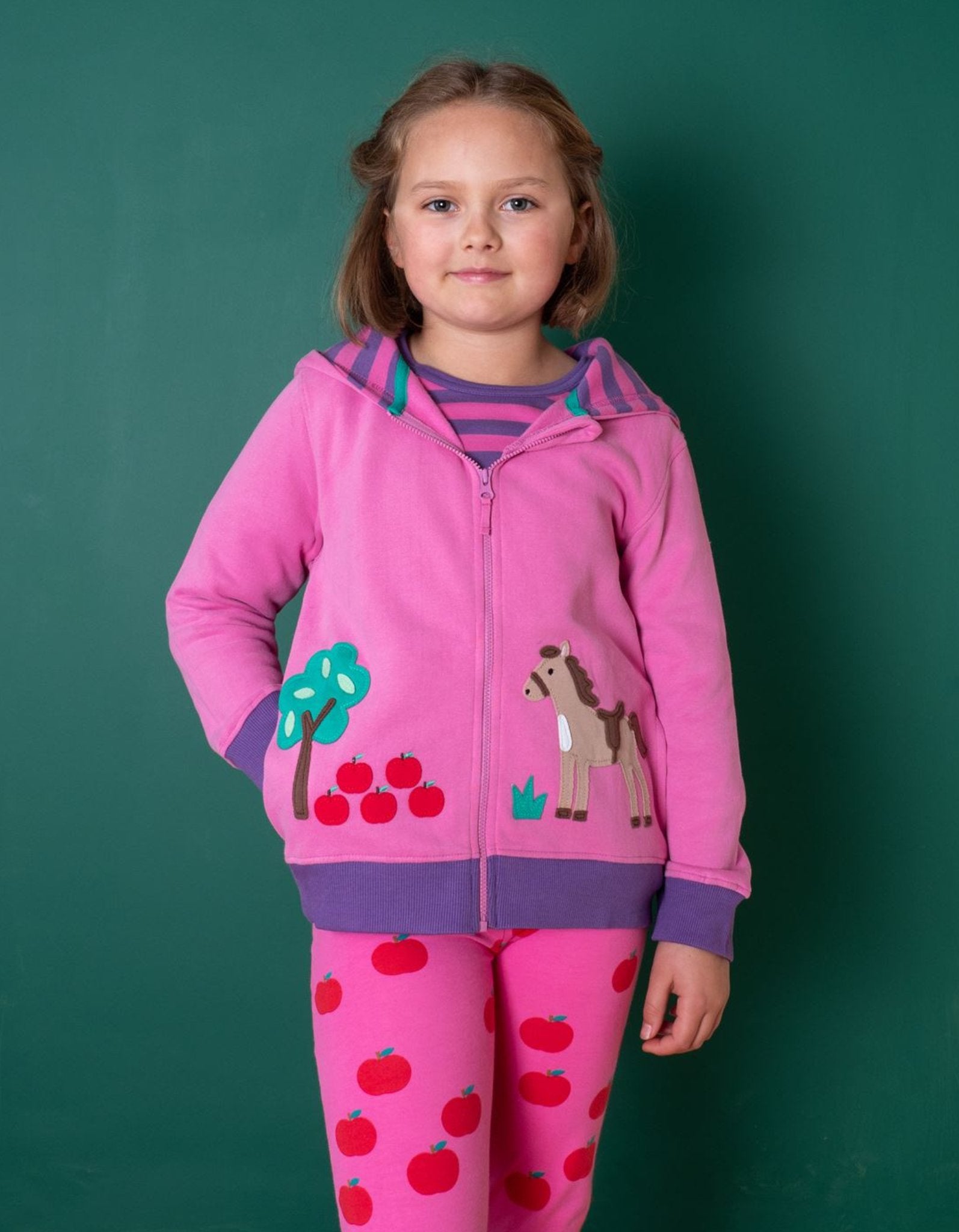Premium kids hoodie with playful horse embroidery, organic cotton, striped fleece lining, bright pink and purple, stylish and cozy by Toby Tiger at brixbailey.com