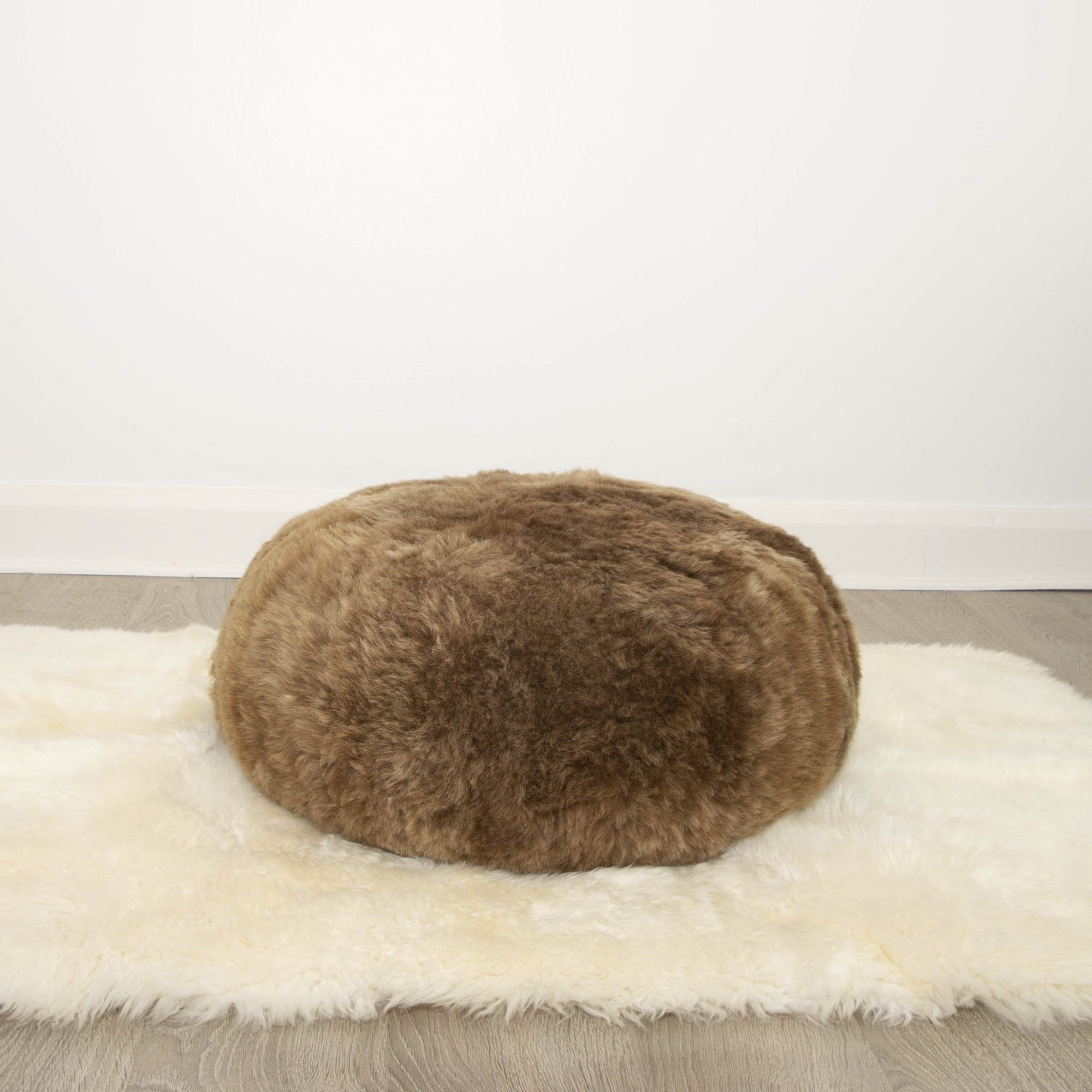 Luxury Hot Buns Sheepskin Pouffe, Icelandic Shorn Fur Floor Cushion, Stylish Low Riding Footrest, Premium Handcrafted Home Decor by Wildash London at brixbailey.com