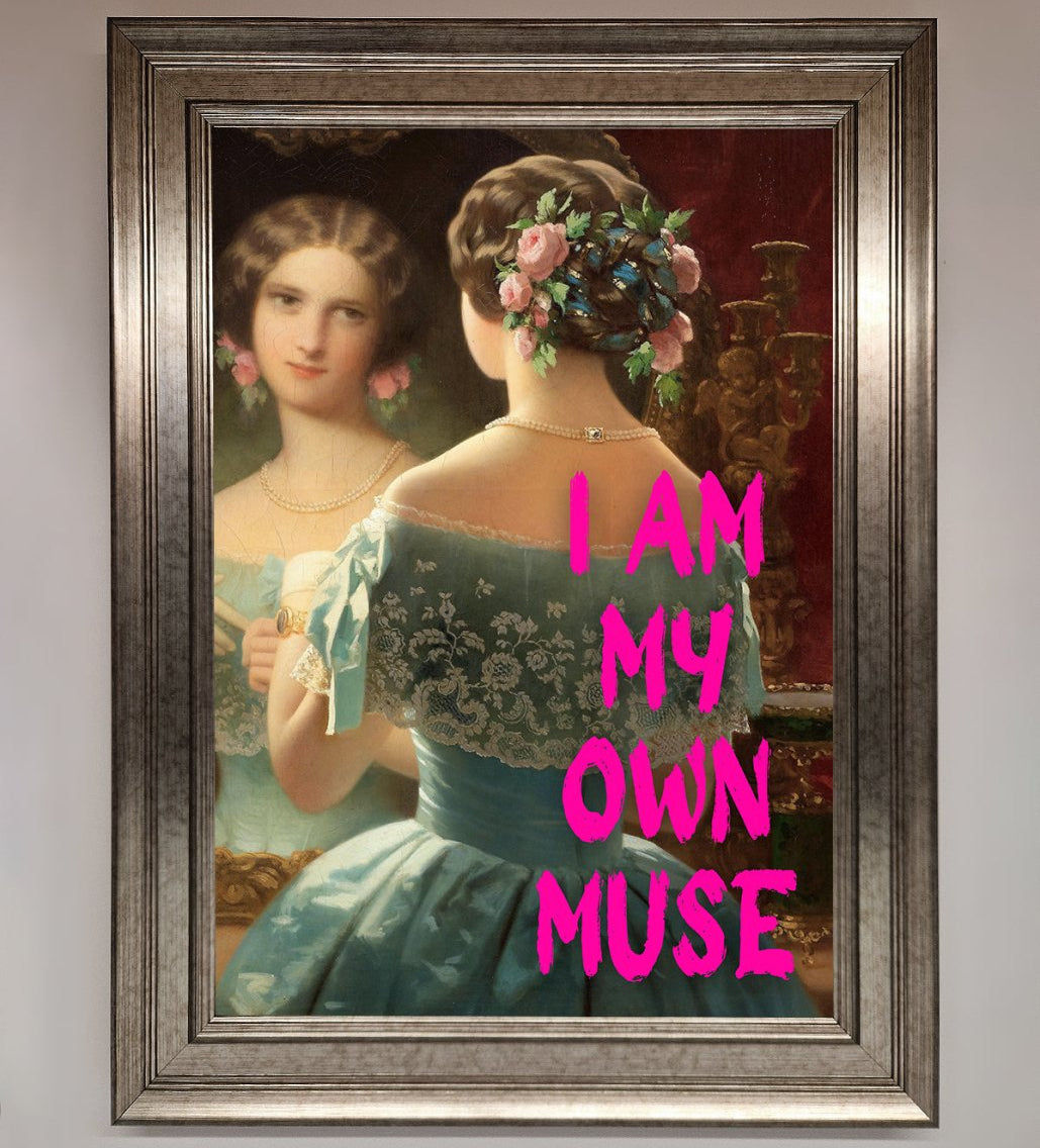 Framed portrait of a woman with floral hairpiece and text 'I AM MY OWN MUSE' on a plain background brix bailey