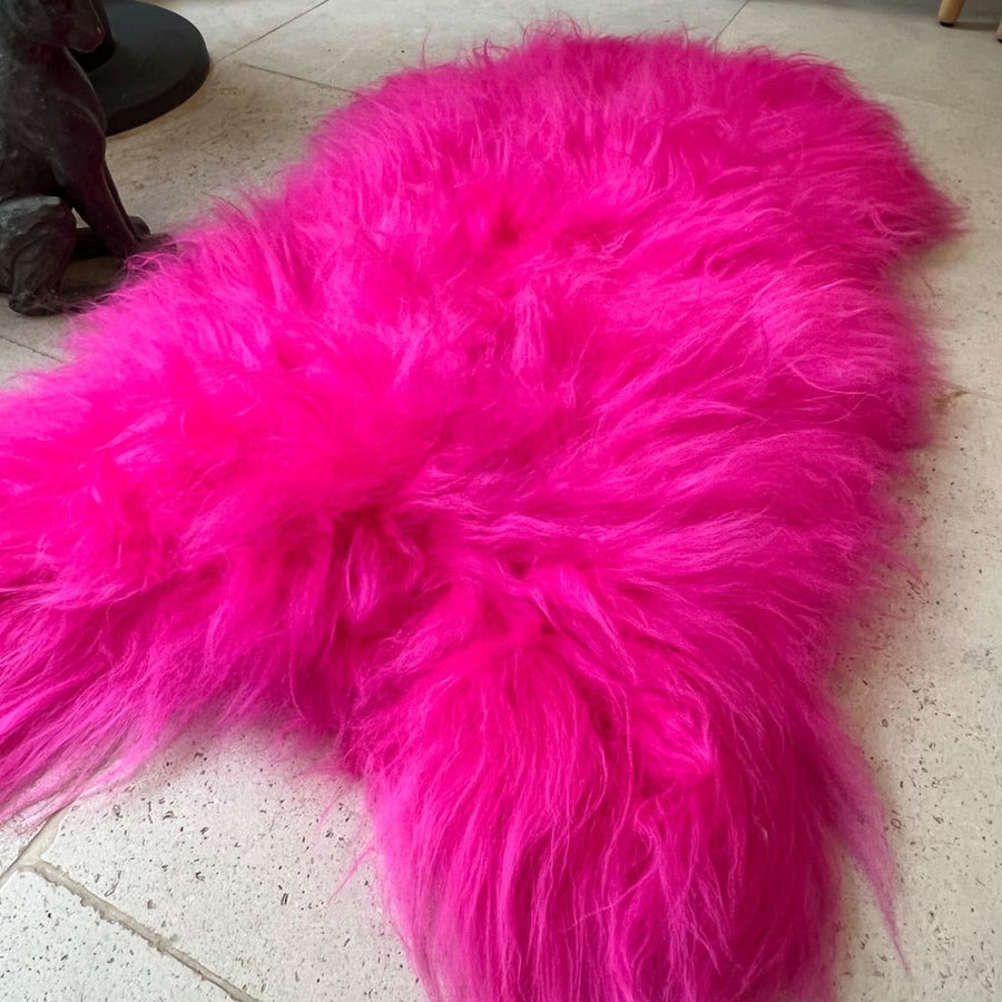 Luxury hot pink sheepskin rug, large Icelandic sheepskin throw, premium handcrafted natural fur, stylish vibrant statement piece by Wildash London at brixbailey.com