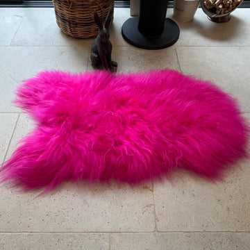 Luxury hot pink sheepskin rug, large Icelandic throw, premium natural fur, 100-110cm, stylish statement piece for home decor by Wildash London at brixbailey.com