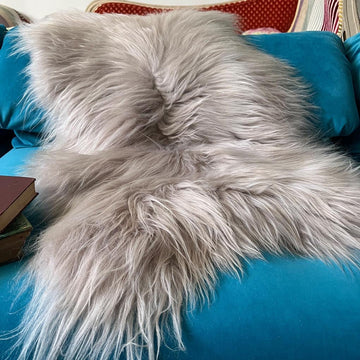 Luxury Icelandic sheepskin throw in dove grey, premium long-haired ethically sourced sheepskin rug, best-selling sustainable home decor by Wildash London at brixbailey.com