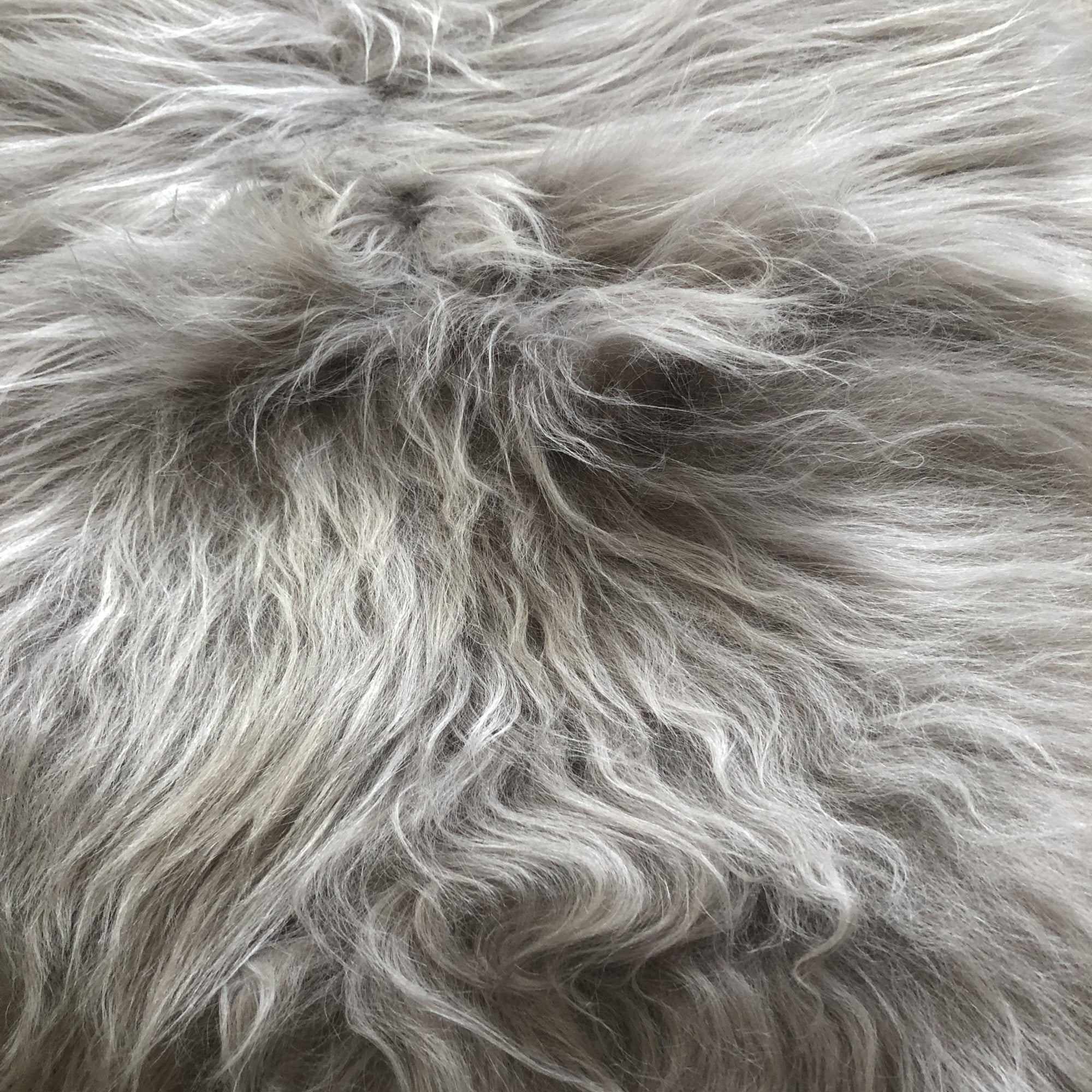 Luxury Icelandic sheepskin throw, premium long-haired dove grey sheepskin rug, ethically sourced, sustainable, handcrafted, best-selling by Wildash London at brixbailey.com
