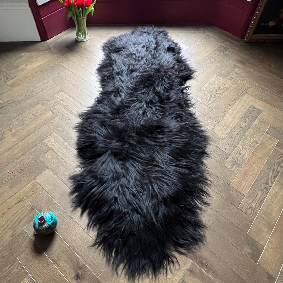 Luxury Icelandic sheepskin rug, premium long fur natural black runner, double back to back, handmade, soft and cozy, best-selling home decor by Wildash London at brixbailey.com