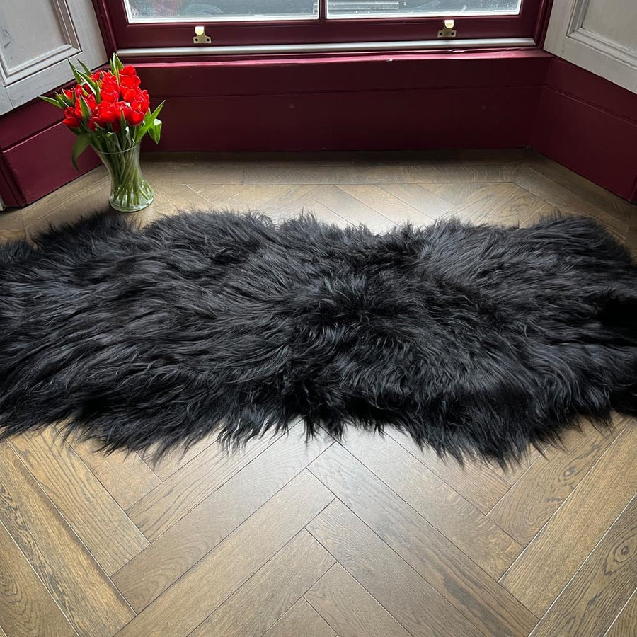 Luxury Icelandic sheepskin rug, premium long fur black runner, double back to back, 100% natural, handcrafted, best-selling home decor by Wildash London at brixbailey.com