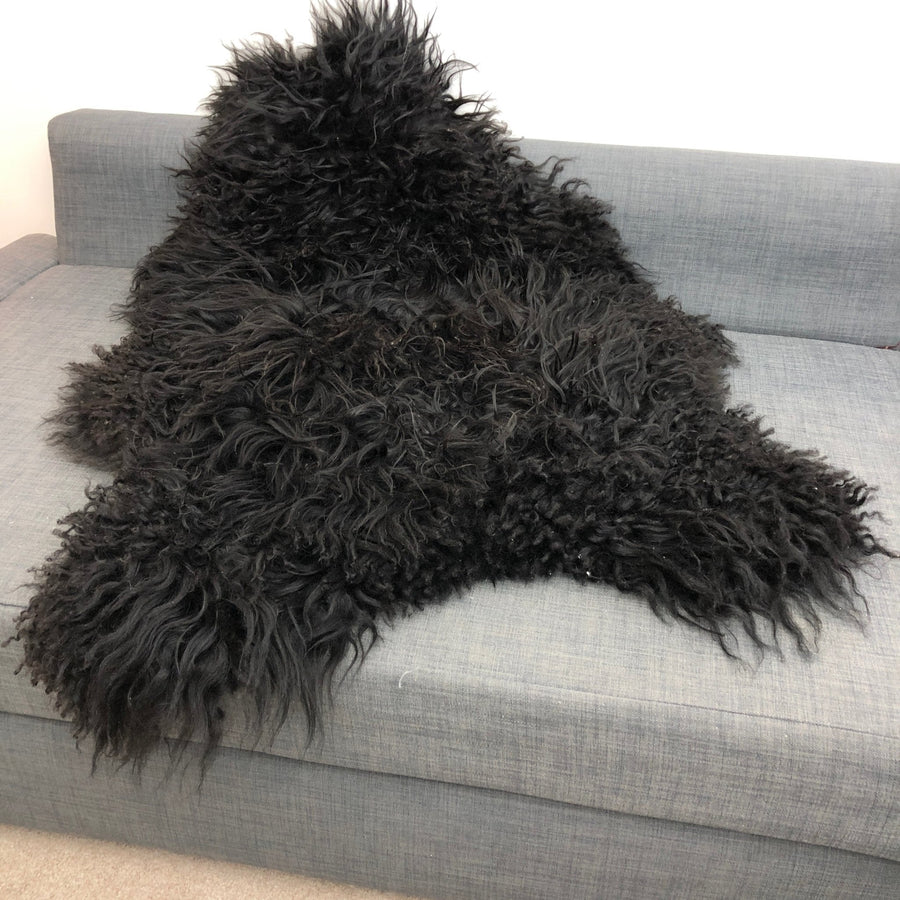 Premium Icelandic sheepskin rug, natural black, long curly hypoallergenic fur, ethically sourced, luxury free-range sheepskin throw by Wildash London at brixbailey.com
