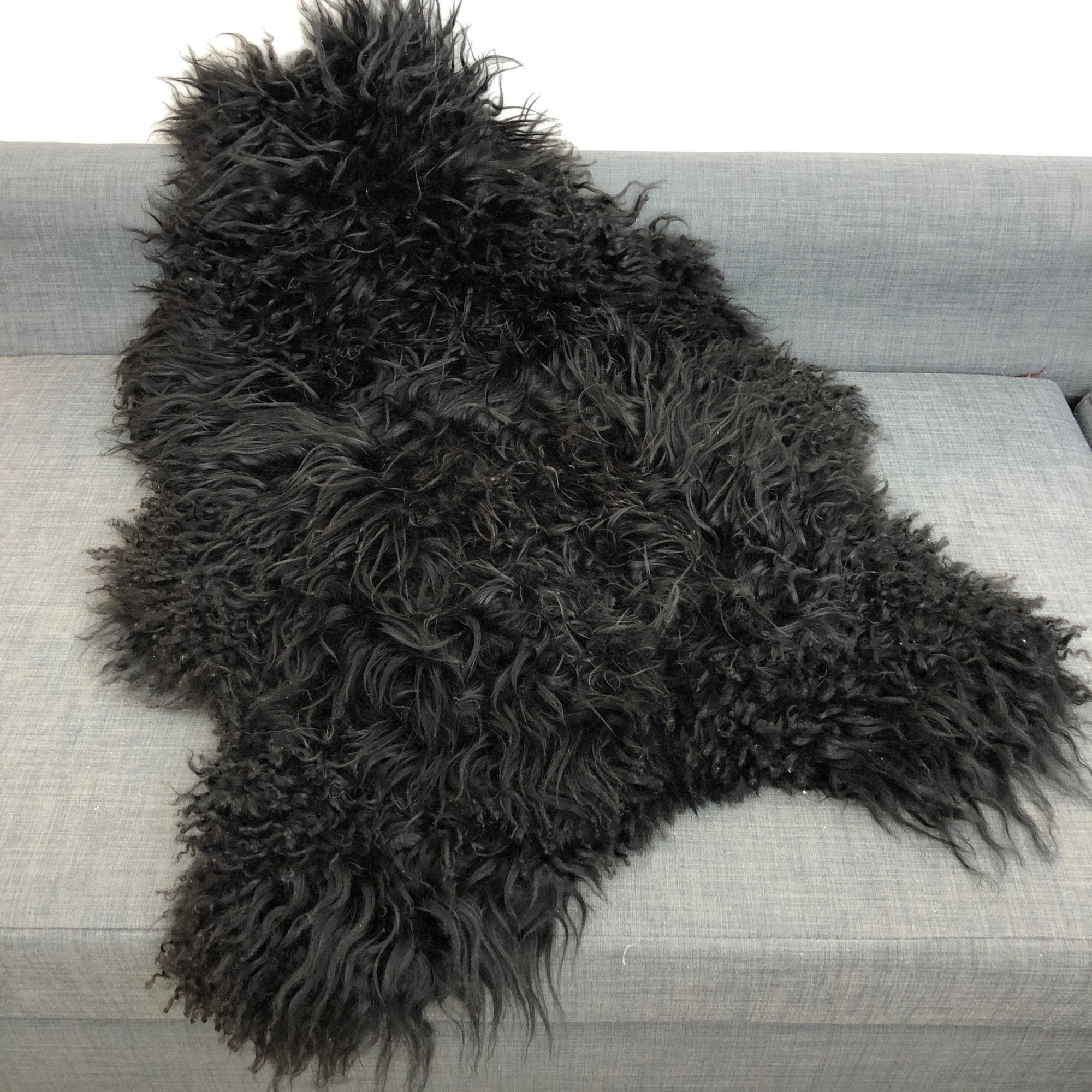 Premium Icelandic sheepskin rug, natural black, long curly hypoallergenic fur, luxury free-range ethically sourced hide by Wildash London at brixbailey.com