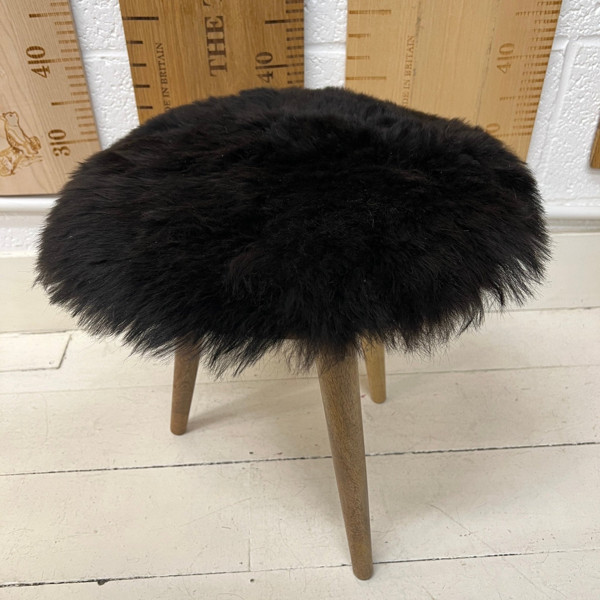 Luxury Icelandic black shorn sheepskin round seat pad, 35cm diameter, premium Scandinavian style, sustainable eco-tanned, soft and breathable by Wildash London at brixbailey.com
