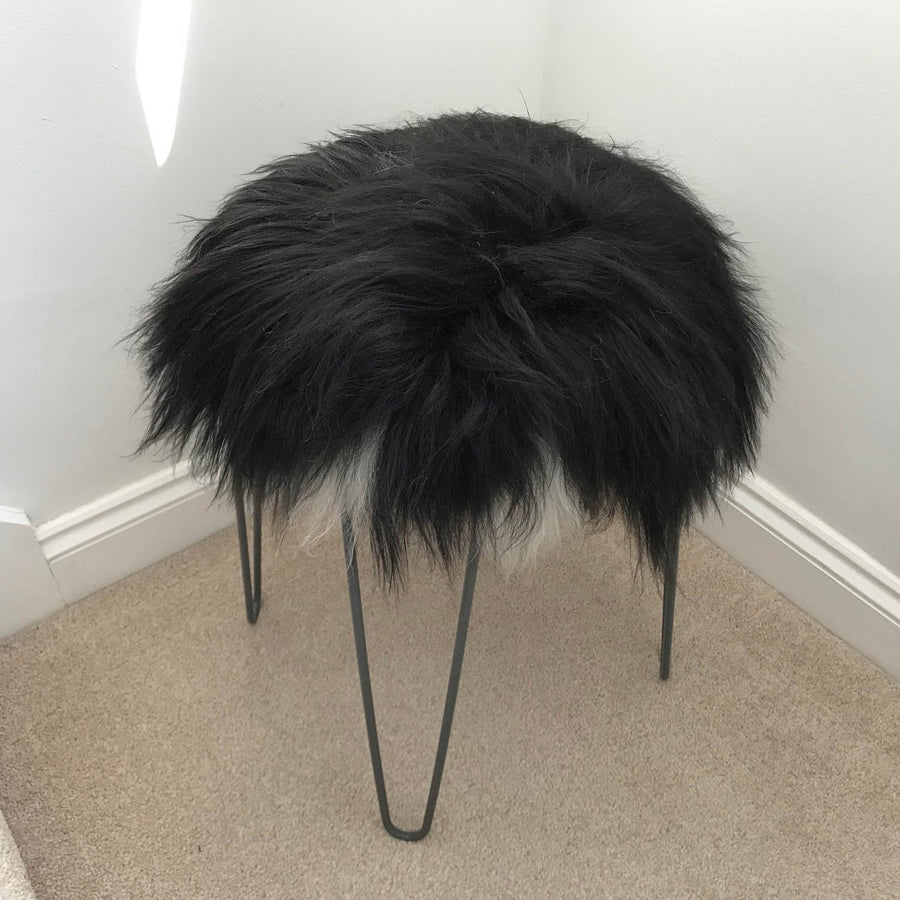 Luxury Icelandic sheepskin round seat cover, natural black and white, 35cm diameter, premium handcrafted fur, hypoallergenic and sustainable by Wildash London at brixbailey.com