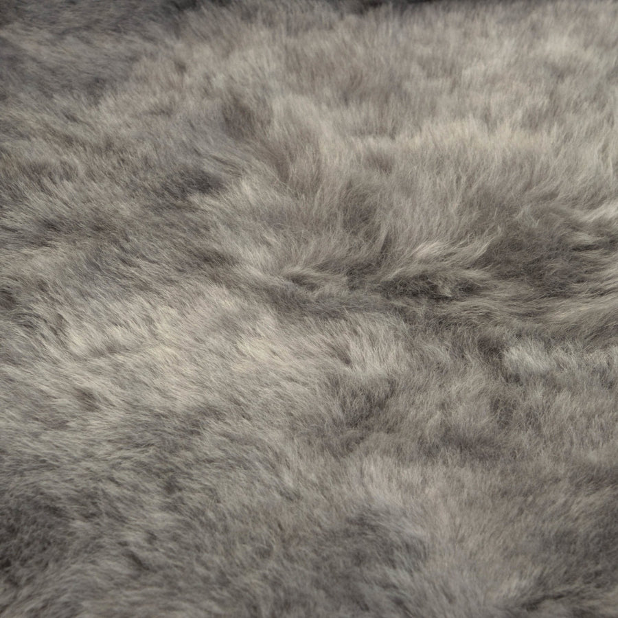Premium Icelandic sheepskin rug in cool grey, ethically sourced, handcrafted, 50mm shorn, luxury hypoallergenic fur, sustainable and therapeutic by Wildash London at brixbailey.com