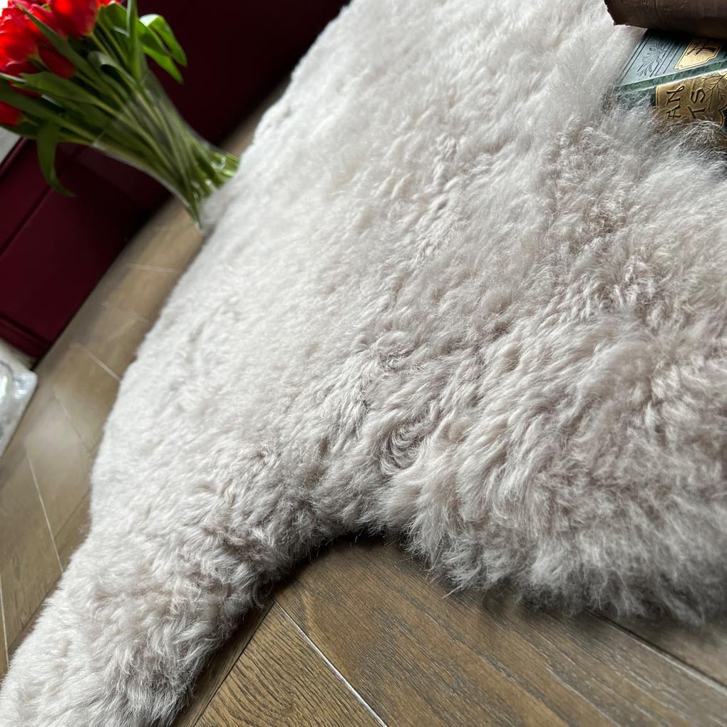 Luxury Icelandic sheepskin throw in dove grey, premium shorn sheepskin rug, medium size, soft hypoallergenic fur, sustainable and machine washable by Wildash London at brixbailey.com