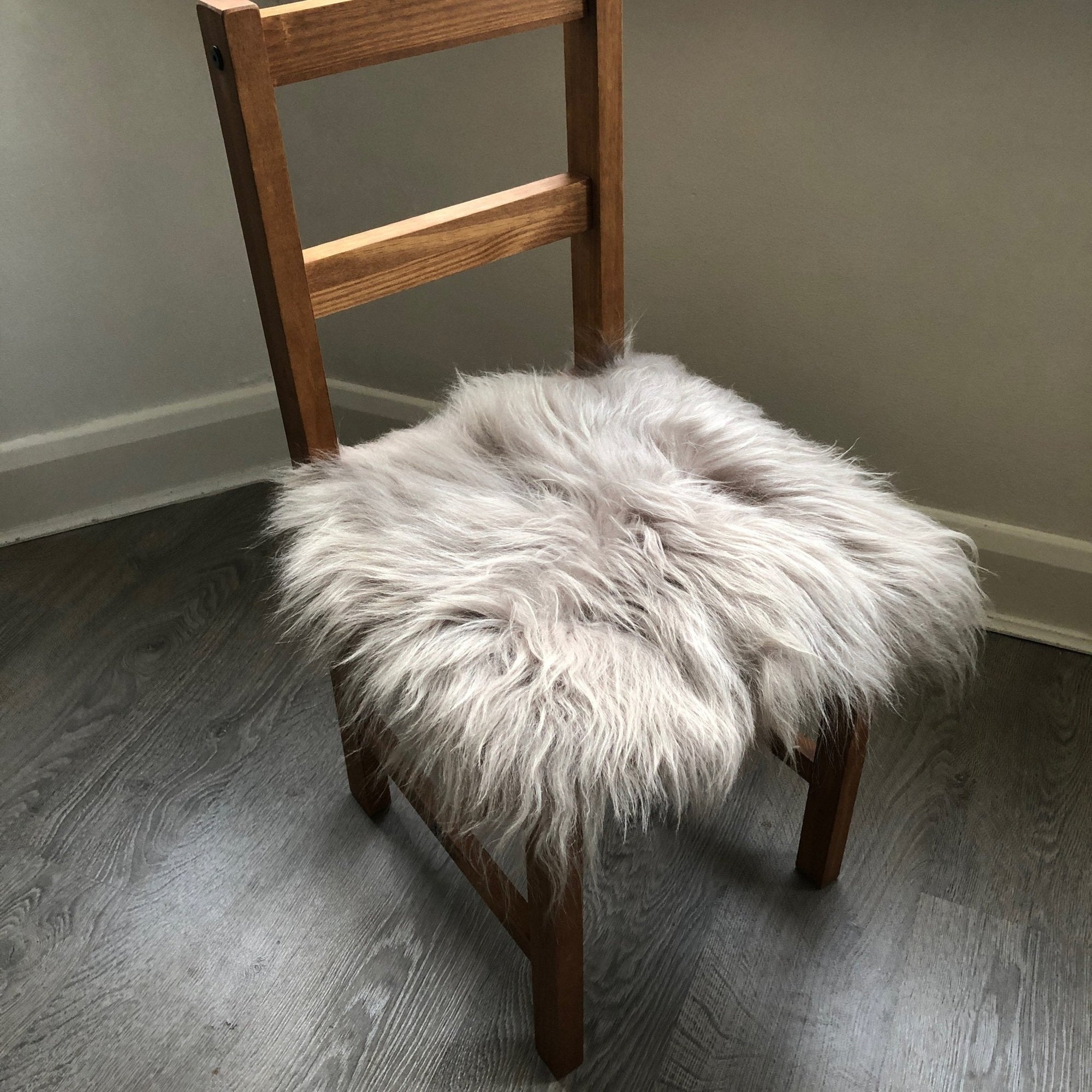 Premium British sheepskin seat cover in dove grey, 100% natural free-range sheepskin, luxury hypoallergenic fur, handcrafted sustainable home decor by Wildash London at brixbailey.com