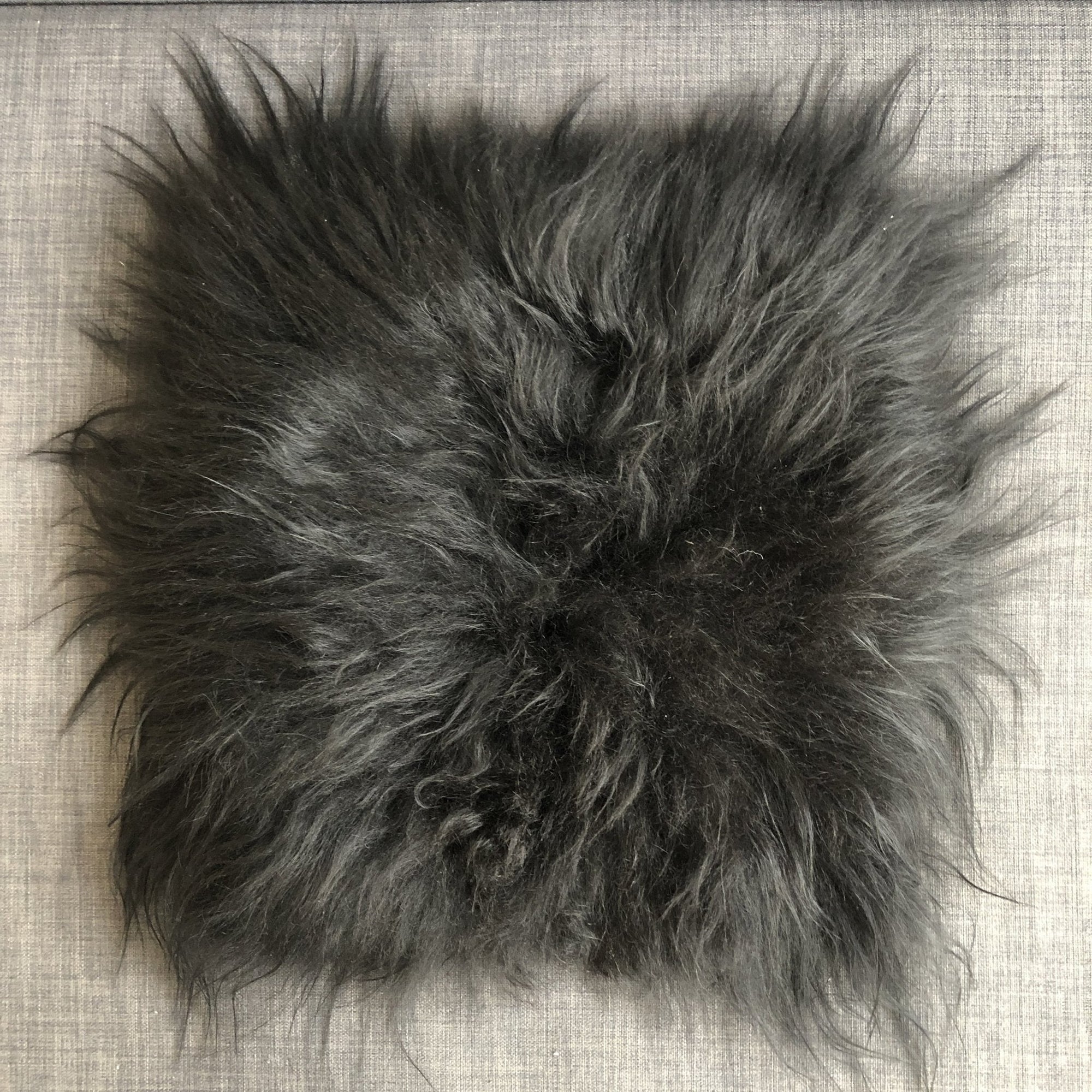 Luxury natural black Icelandic sheepskin seat cover, premium undyed long fur, handcrafted sustainable square pad 37cm by Wildash London at brixbailey.com