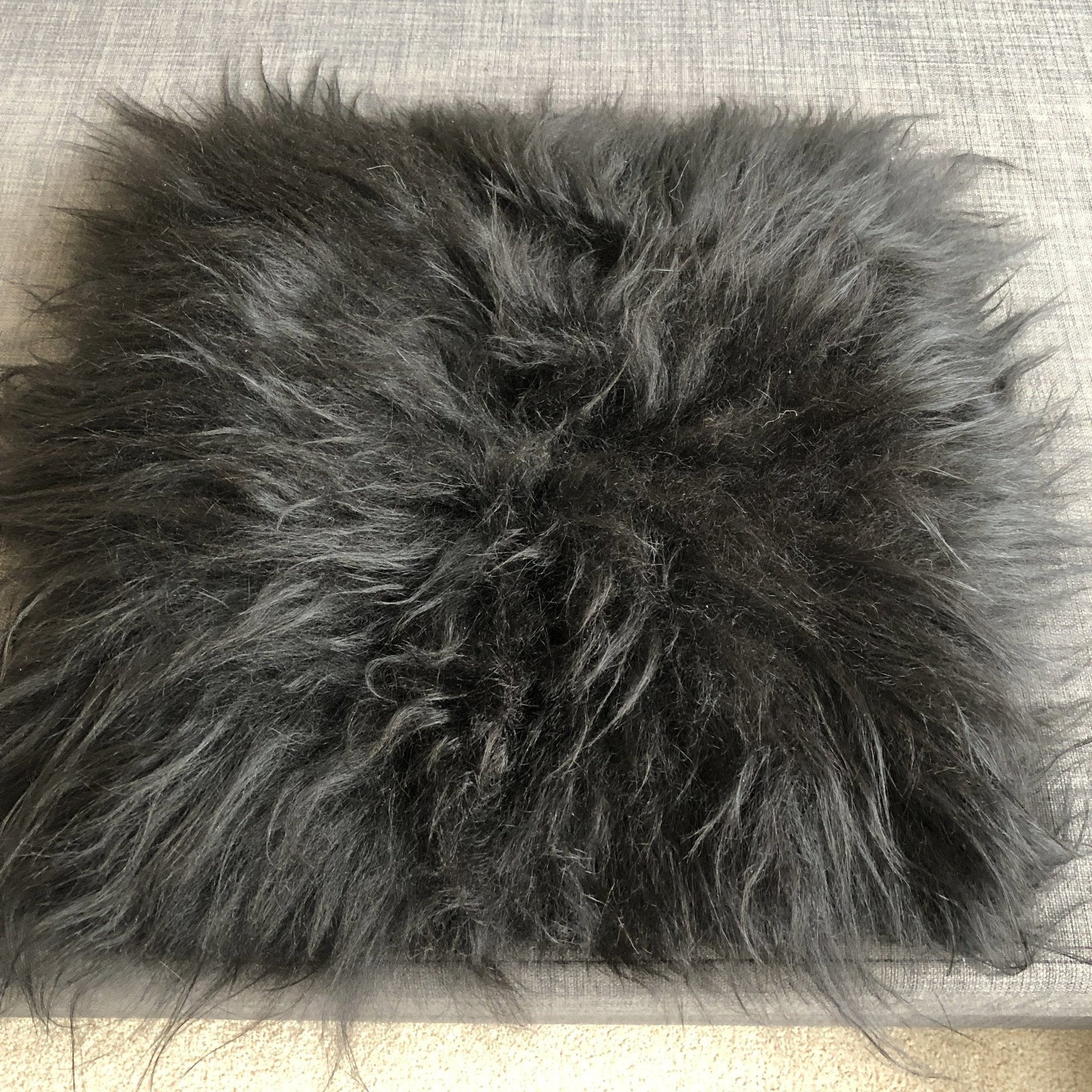 Luxury natural black Icelandic sheepskin seat cover, premium undyed fur, handcrafted, sustainable, hypoallergenic, machine washable by Wildash London at brixbailey.com